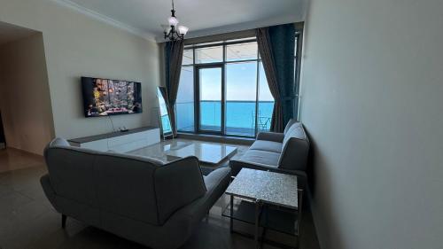 Photo #3 of Beachfront holiday homes with beach,sauna,jacuzzi,cafe,restaurants and more in Ajman, United Arab Emirates