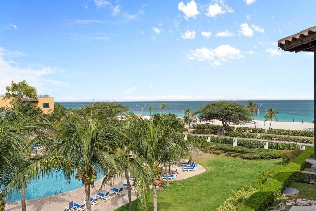 Photo #1 of Beachfront - Beach Garden Studio - E124-1 in Oranjestad West, Aruba