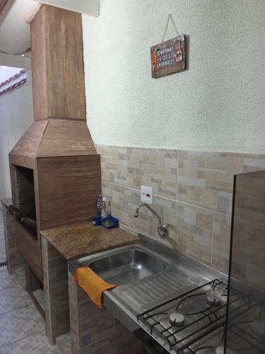 Photo #2 of "Excelente Casa Pé na Areia com Piscina, Ampla Área de Lazer com Espaço Gourmet Externo, Deck Coberto com Churrasqueira e Cooktop, Cozinha Americana, Ampla Sala de Estar com Lindíssima Lareira, Smart TV 50", Wi-Fi e o Principal é muito Pertinho da Praia" in Nova Mirim, Brazil