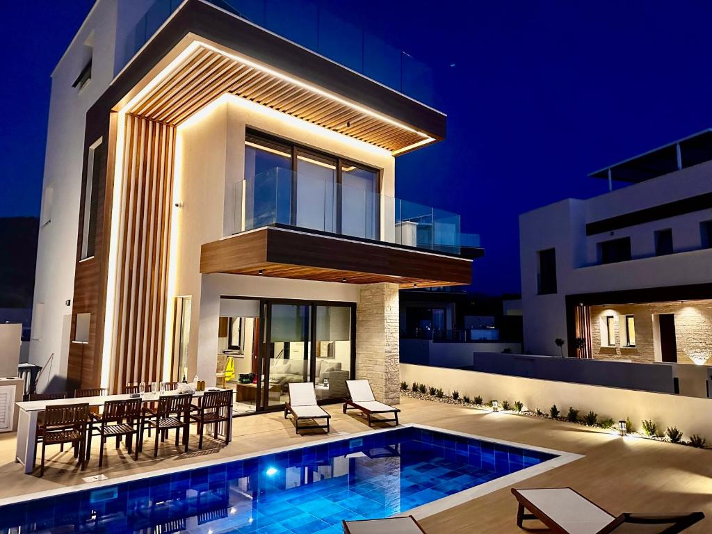 Photo of Santa Barbara Seafront villas w jacuzzi pool in Argaka, Cyprus