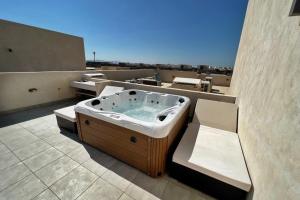 Photo #5 of Spectacular & Soaring 2 BDR w Private Rooftop Jacuzzi & Beach Access in El Gouna, Egypt