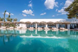 Photo #4 of Isla Brown Corinthia Resort & Spa, Curio Collection by Hilton in Agii Theodori, Greece