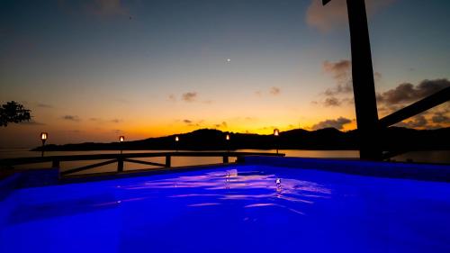 Photo #2 of El Palacio Rosa on Blue Lagoon 2BR Beachfront Suite on pristine & quiet bay w incredible views in Arrozal, Honduras