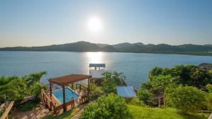 Photo #5 of El Palacio Rosa on Blue Lagoon 2BR Beachfront Suite on pristine & quiet bay w incredible views in Arrozal, Honduras