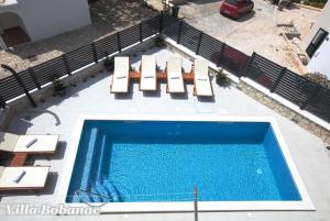 Photo #6 of Vacation house with heated swimming pool 70 meters from the beach-Bobanac in Ražanj, Croatia