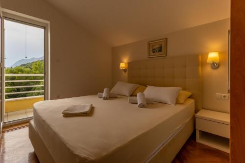 Photo #2 of Luxury Apartments Villa Ruzmarina with New heated Infinity Pool and Lounge Area in Marušići, Croatia
