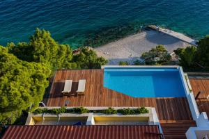 Photo #4 of Luxury Apartments Villa Ruzmarina with New heated Infinity Pool and Lounge Area in Marušići, Croatia