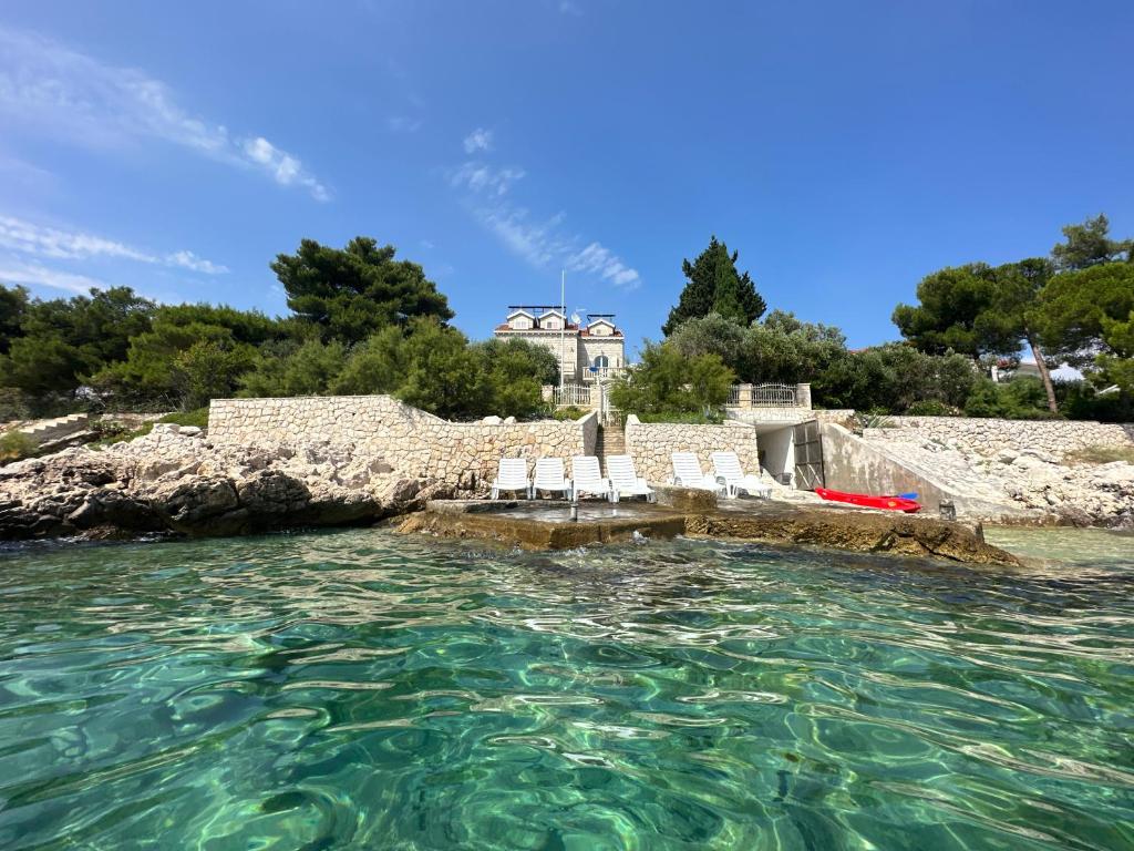 Photo #1 of Luxury Seaside Villa with a classic Mediterranean Olive Garden, a fully equipped Professional Kitchen, Pool, Sauna, Padle Boards and Canoe - Miolin Beach House in Okrug Gornji, Croatia