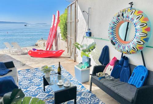 Photo #2 of Luxury Seaside Villa with a classic Mediterranean Olive Garden, a fully equipped Professional Kitchen, Pool, Sauna, Padle Boards and Canoe - Miolin Beach House in Okrug Gornji, Croatia