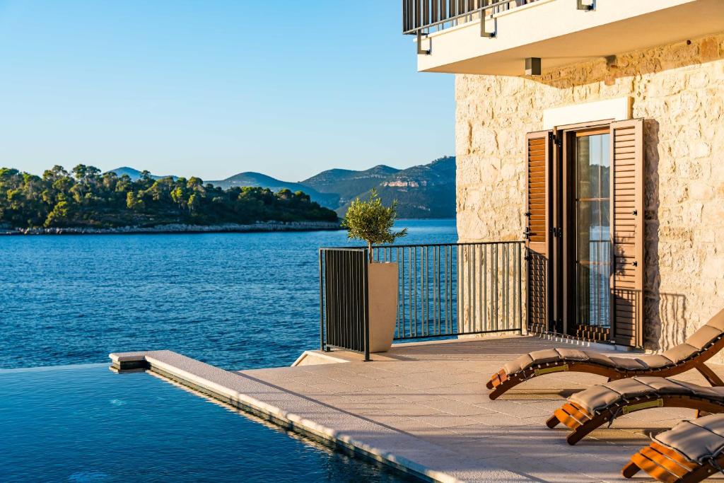 Photo #1 of Seafront Villa Draga with heated infinity pool in Solin, Croatia