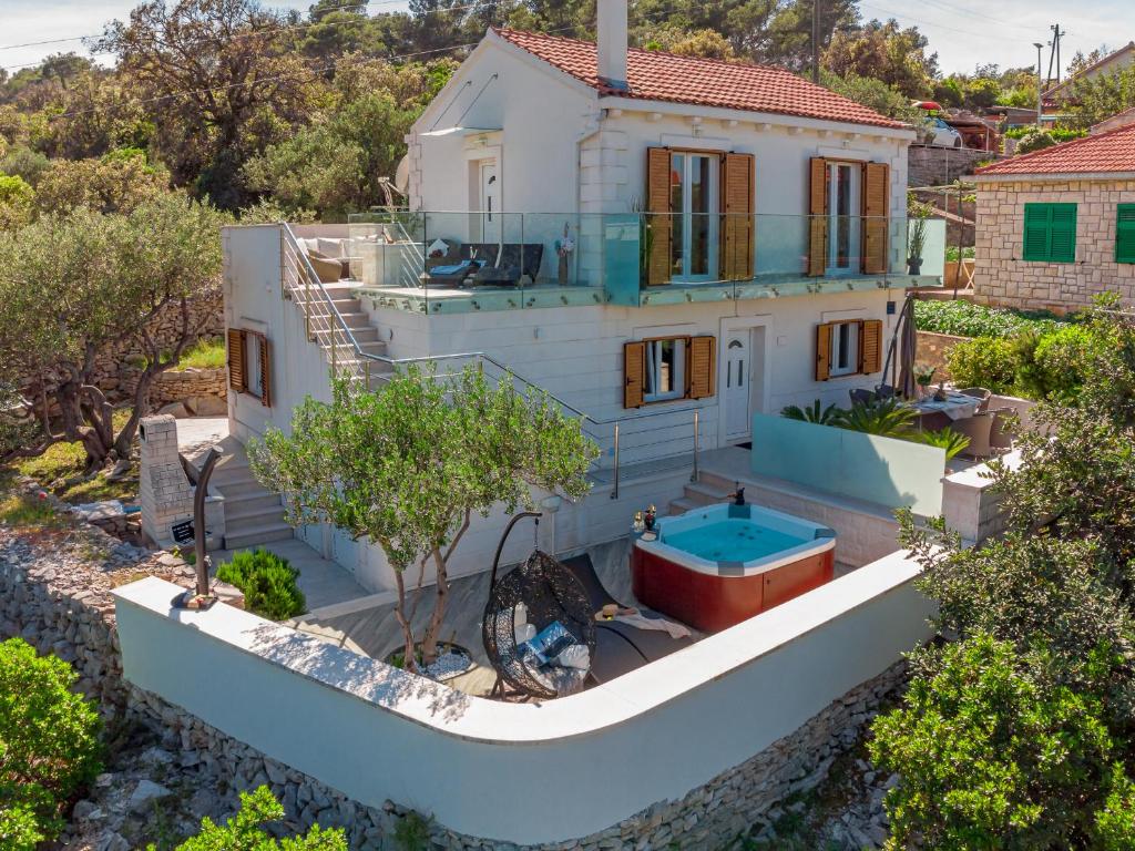 Photo #1 of Uniquely designed Villa Ivana with outdoor Jacuzzi nearby the pebble Banje beach at the Island of Solta in Grohote, Croatia