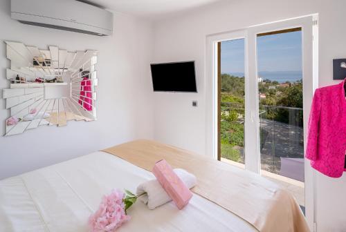 Photo #2 of Uniquely designed Villa Ivana with outdoor Jacuzzi nearby the pebble Banje beach at the Island of Solta in Grohote, Croatia