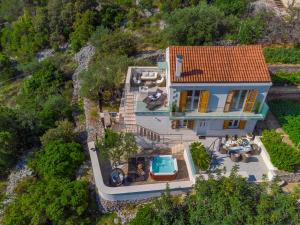 Photo #4 of Uniquely designed Villa Ivana with outdoor Jacuzzi nearby the pebble Banje beach at the Island of Solta in Grohote, Croatia