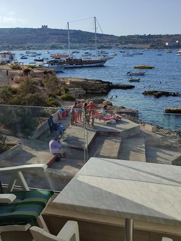 Photo #1 of BEACHFRONT with Seaviews Apartment No56 Award Winner Unbeatable Location for Closeness to the Sea Ideal for Guests looking for Winter Spring and Autumn Breaks in Sunny Malta Also Ideal for Coastal Hikers in Marsaskala, Malta