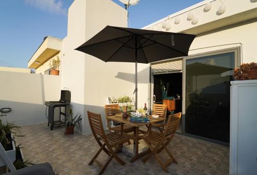 Photo #3 of Cosy Designer Seaview Penthouse with Terrace & BBQ in San Pawl il Baħar, Malta
