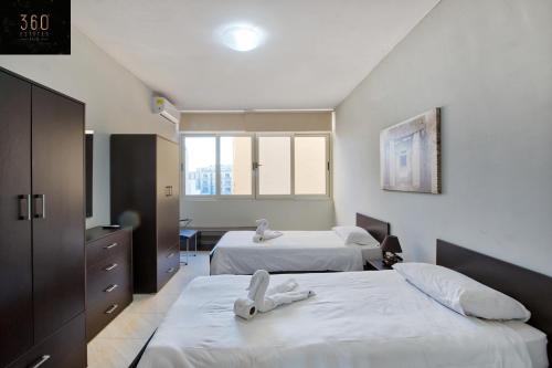 Photo #2 of Sliema Seafront 3BR - opposite Beach - AC & Wifi by 360 Estates in Tas Sliema, Malta