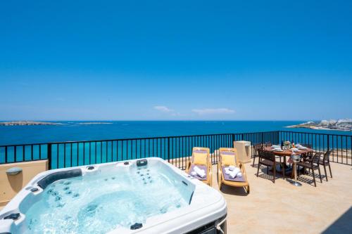 Photo #3 of Islet Promenade Seafront Penthouse with breathtaking seaviews and private hot tub on the large terrace by Getawaysmalta in San Pawl il Baħar, Malta