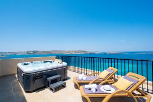 Photo #4 of Islet Promenade Seafront Penthouse with breathtaking seaviews and private hot tub on the large terrace by Getawaysmalta in San Pawl il Baħar, Malta