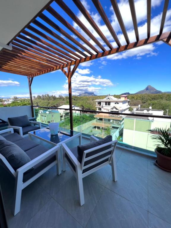 Photo of Top-Floor Modern 3BD Penthouse with Beautiful Mountain View Terrace - 5 min Walk to Beach in Flic en Flac, Mauritius
