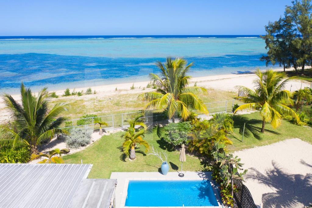 Photo of Chalet Kestrel with pool on the beach in Surinam, Mauritius