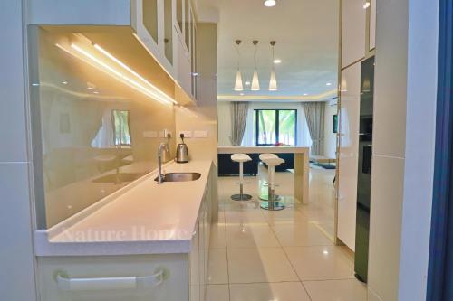Photo #3 of Nature Home 2 - Swiss Garden Resort Residences Beachfront Villa in Kuantan, Malaysia