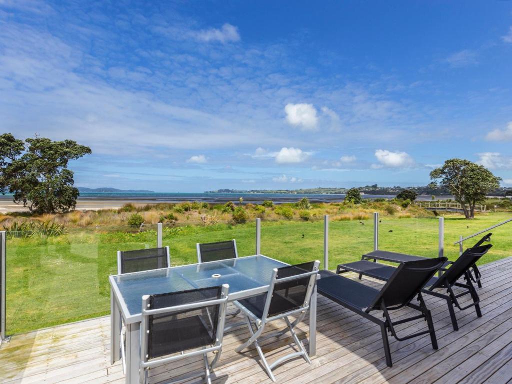 Photo #1 of Beachfront Escape - Snells Beach Holiday Home in Snells Beach, New Zealand