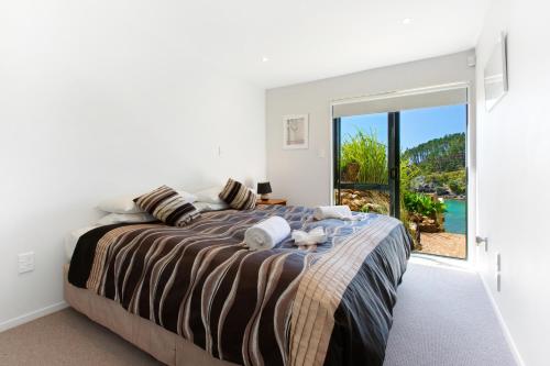 Photo #2 of Beachfront Enclosure Bay - Waiheke Unlimited in Waiheke Island, New Zealand