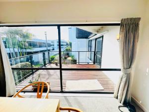 Photo #6 of Spacious Mission Bay Villa 100m to the beach, seaview, private garden, Netflix in Auckland, New Zealand