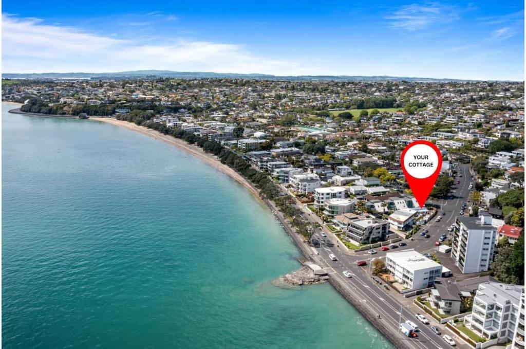 Photo #1 of Escape to Kohi Cottage - Your Beachside Haven in Auckland, New Zealand