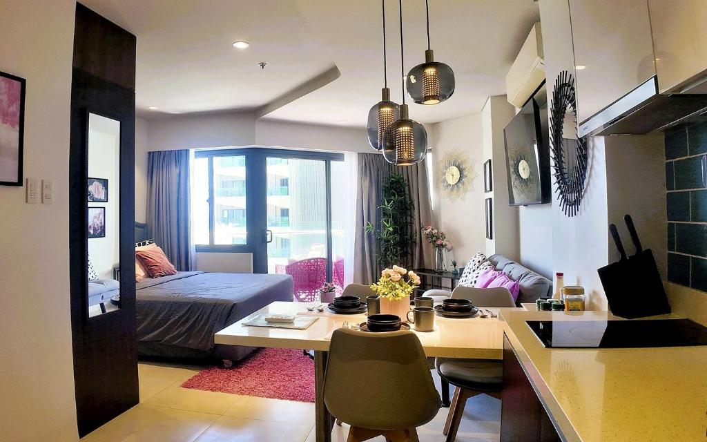 Photo of Dominiks pink dream Studio Balcony Ocean View Balcony Fast-Wifi at Tambuli Resort High Floor in Lapu lapu City, Philippines