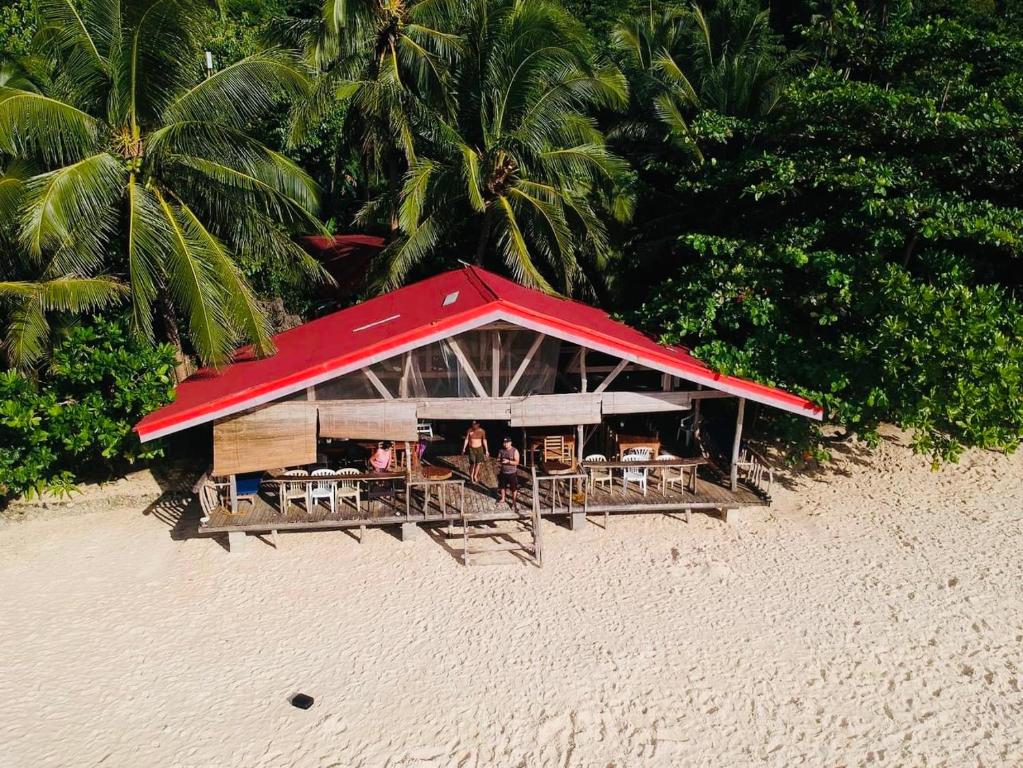 Photo of White Beach Front and Cottages in Buruanga, Philippines