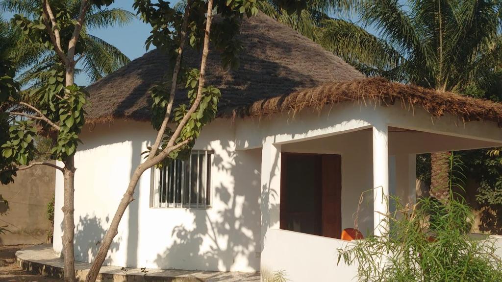 Photo of Case traditionnelle diola au bord de l'océan in Cap Skirring, Senegal