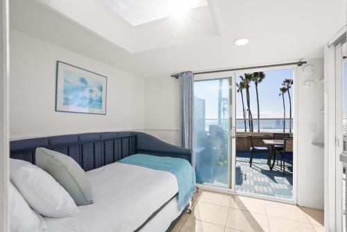 Photo #2 of Beachfront Retreat with Ocean Views Private Rooftop Deck Walk to Pier and Town in Newport Beach, CA