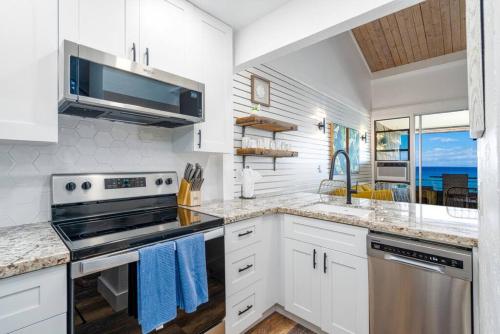 Photo #2 of Modern-Rustic Beach Renovation Direct Oceanfront Penthouse in Napili Honokowai, HI