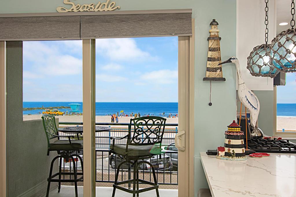 Photo #1 of 201A Beach View, 30 Steps to the sand or pool, Corner condo with extra windows and views in Oceanside, CA