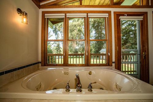 Photo #3 of Luxury Riverside Estate - 3BR Home or 1BR Cottage or BOTH - Sleeps 14 - Swim, fish, relax, refresh in Anderson, CA