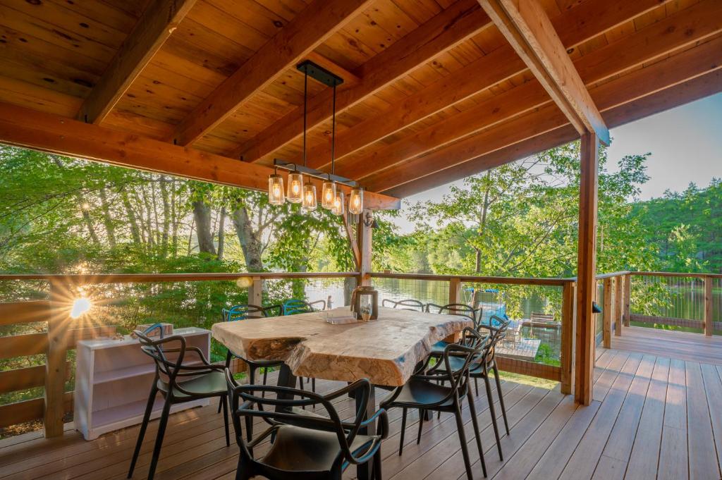Photo of Stylish lake home with private beach, dock and firepit for swimming, kayaking, hiking in Barnstead, NH